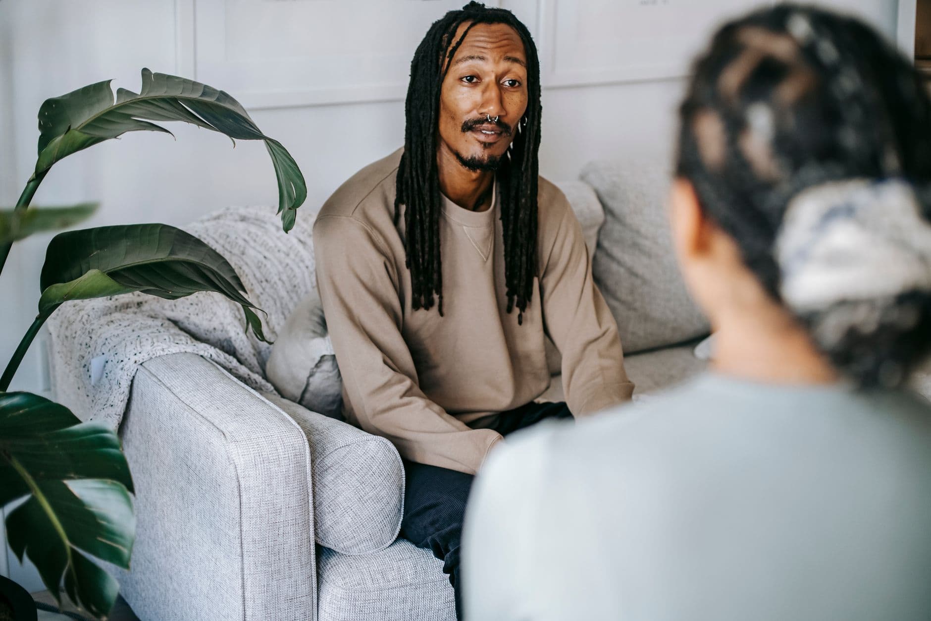 A man in conversation with a caseworker